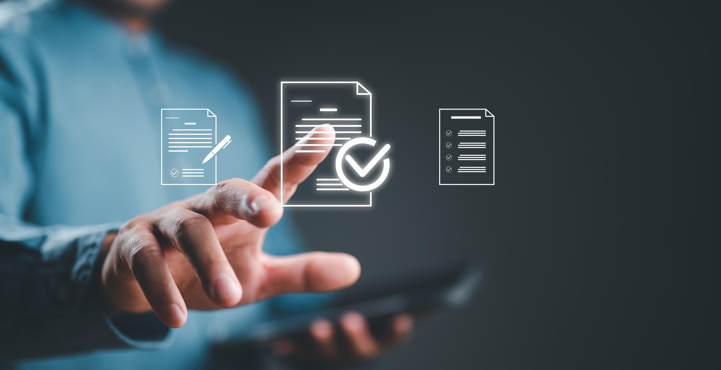 3 paper document icons on a background with a man's finger selecting the middle document icon with a check on it